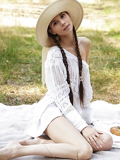 Brunette posing outdoors